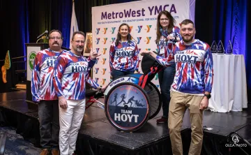 Members of the Hoyt Family pose with Rick Hoyt's wheelchair