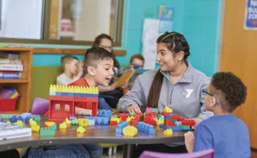 y staff and kids playing with legos