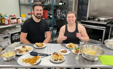 two adults during cooking class