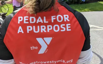 photo of the back of a shirt that says Pedal for a Purpose