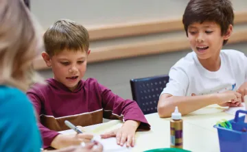 photo of two boys participating in arts and crafts