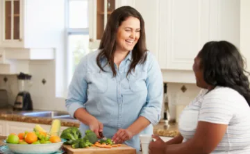 Two women prepare a healthy lunch