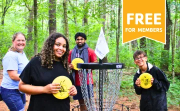 MetroWest YMCA staff and teen members playing Disc Golf at Hopkinton Outdoor Center