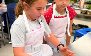 Children in the teaching kitchen baking